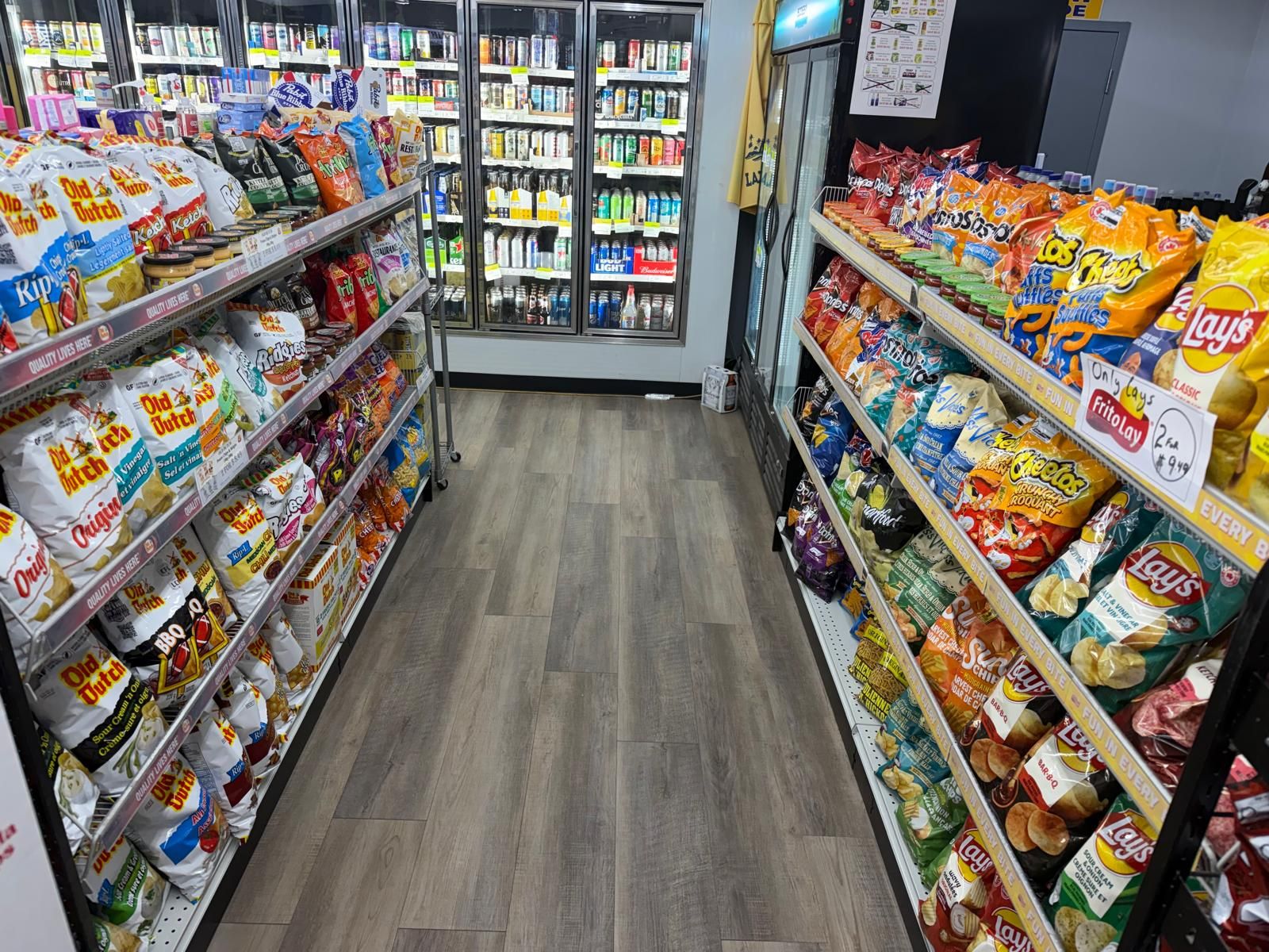 Snack aisles with the cold beer coolers behind