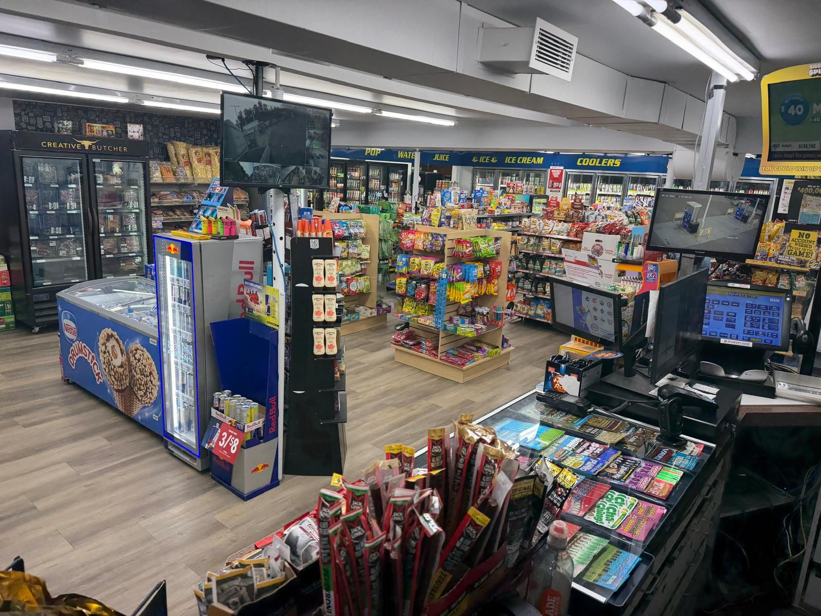 Inside Garven Convenience, looking across the aisles toward the front counter