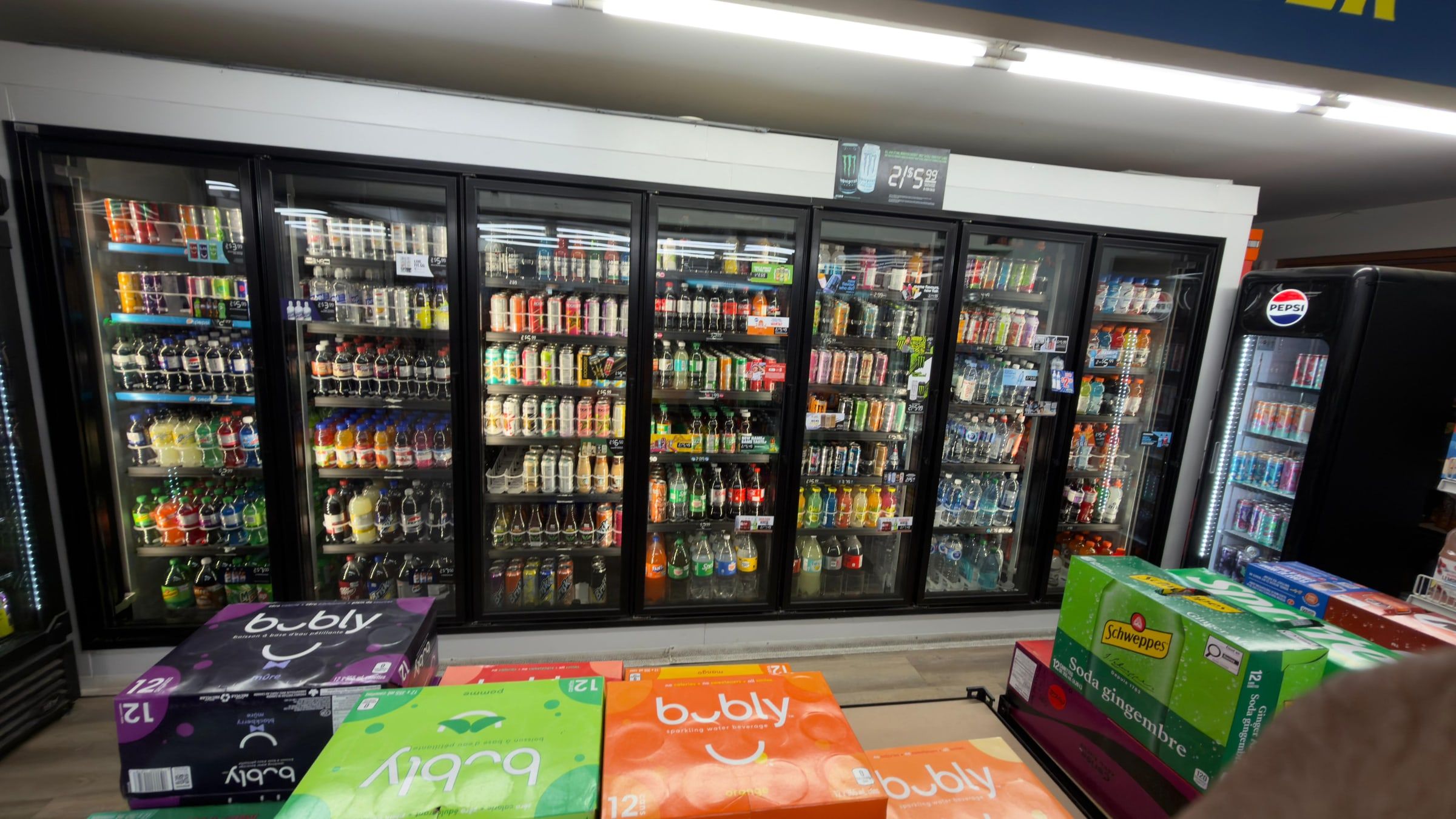 The pop, water and juice cooler wall