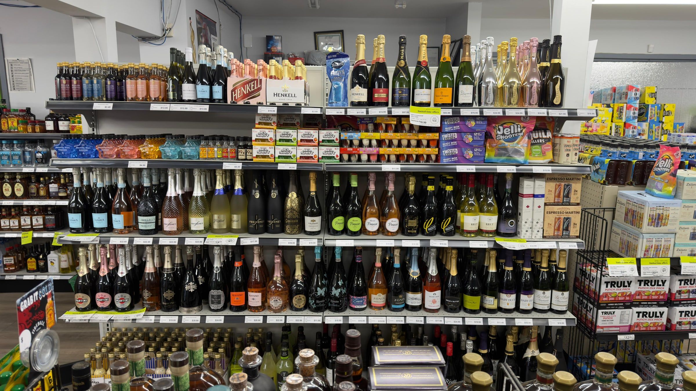 The sparkling shelf — prosecco, cava and champagne, with coolers alongside